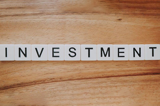 scrabble tiles read investment